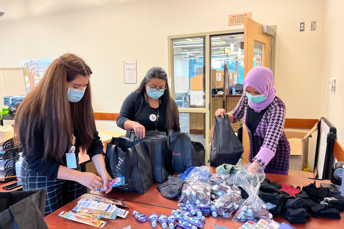 Volunteers organizing donations for recently arrived refugees.